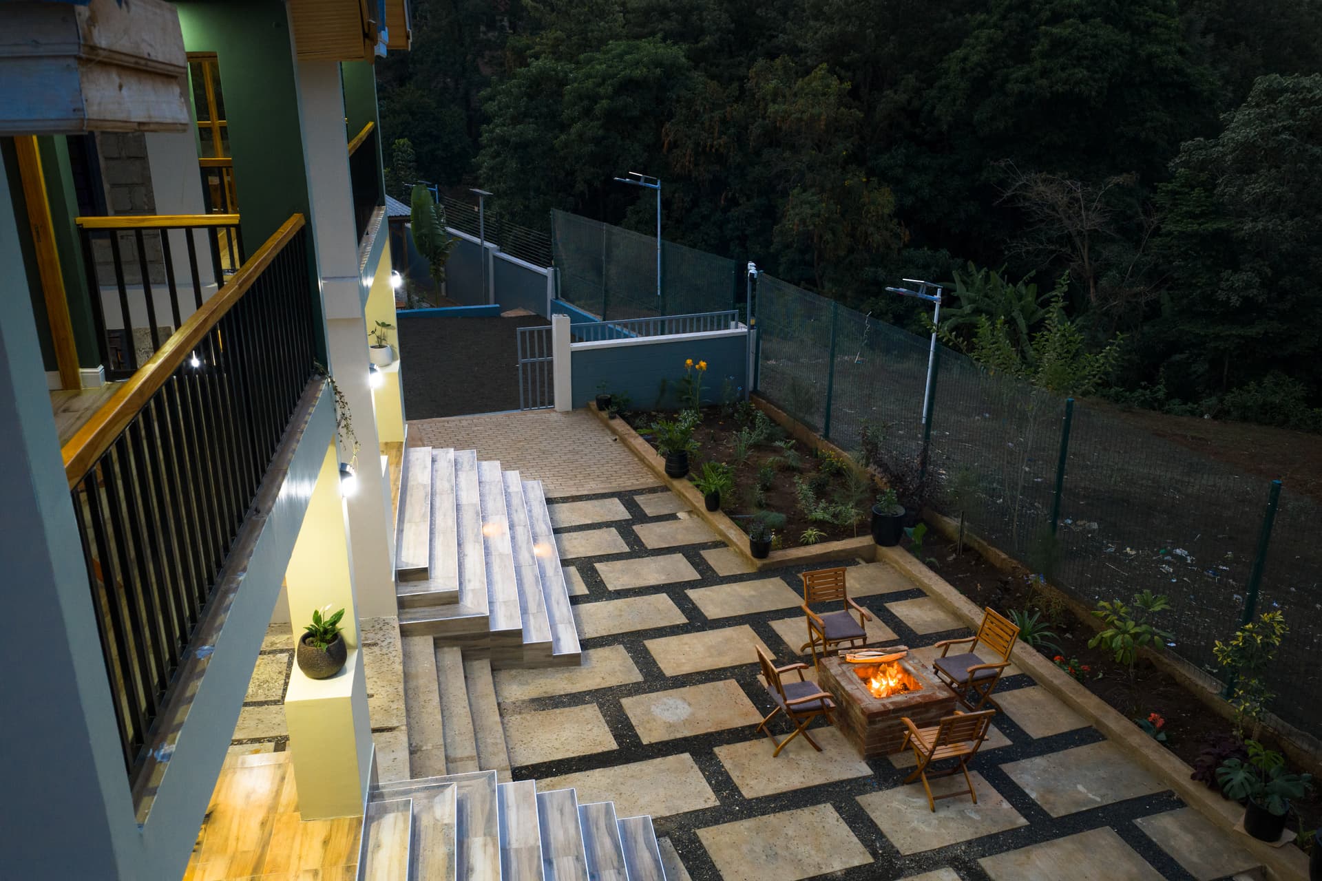 Evening courtyard with fire pit at Starico Residence